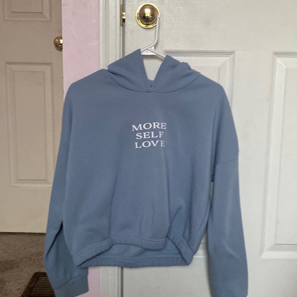 blue "more self love" sweatshirt